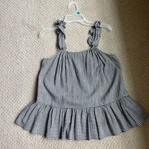 Black and white gingham tank with adjustable straps and cute peplum detail.